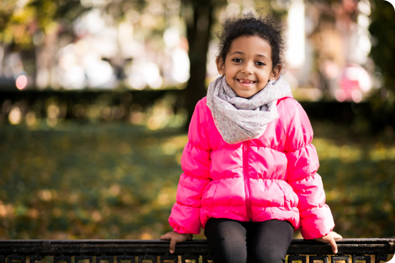 smiling girl in pink jacket