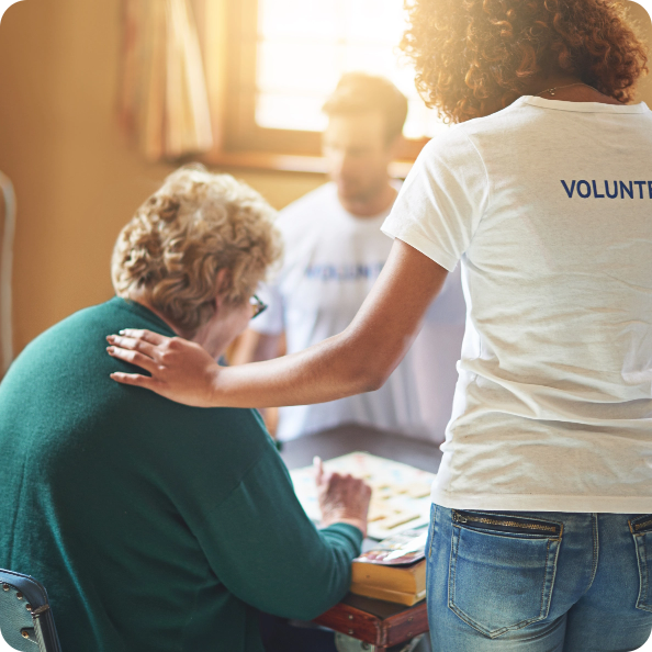 volunteers helping elderly