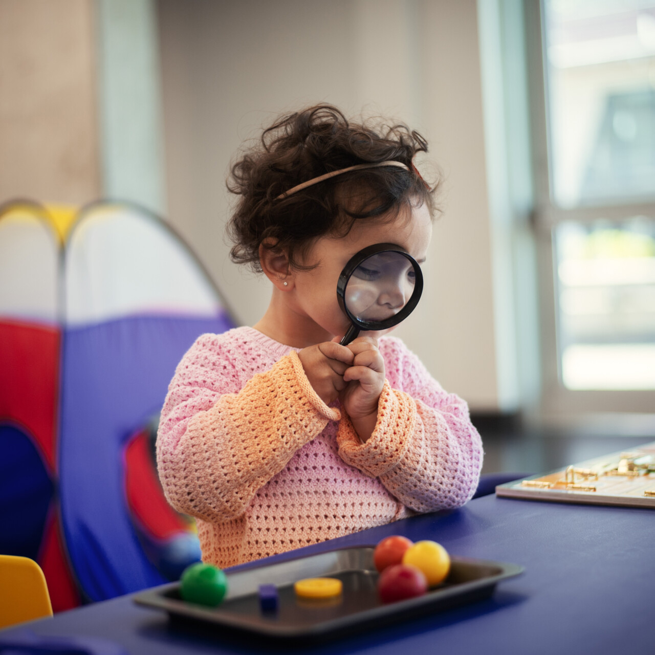 kid with magnifying glass